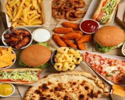 stock-photo-french-fries-pizza-and-other-fast-food-on-wooden-table-flat-lay-2284062205_11zon-1-transformed